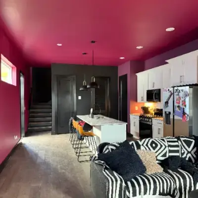 Open living space with a bold magenta ceiling by Mr. Wu's Painting
