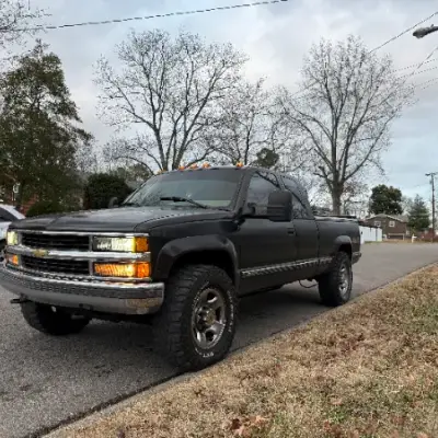 Black pickup truck parked on a residential street